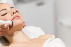 Beautiful woman in professional beauty salon during photo rejuvenation procedure